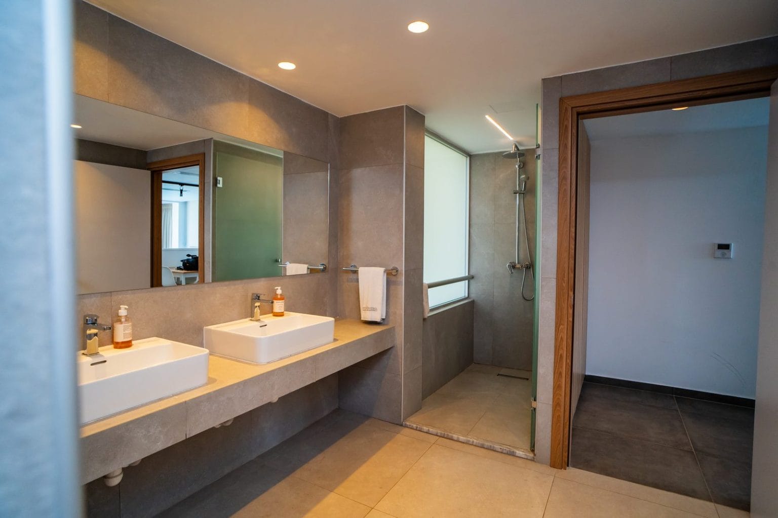 Deluxe Suite bathroom with twin basins at Malama Beach Holiday Village