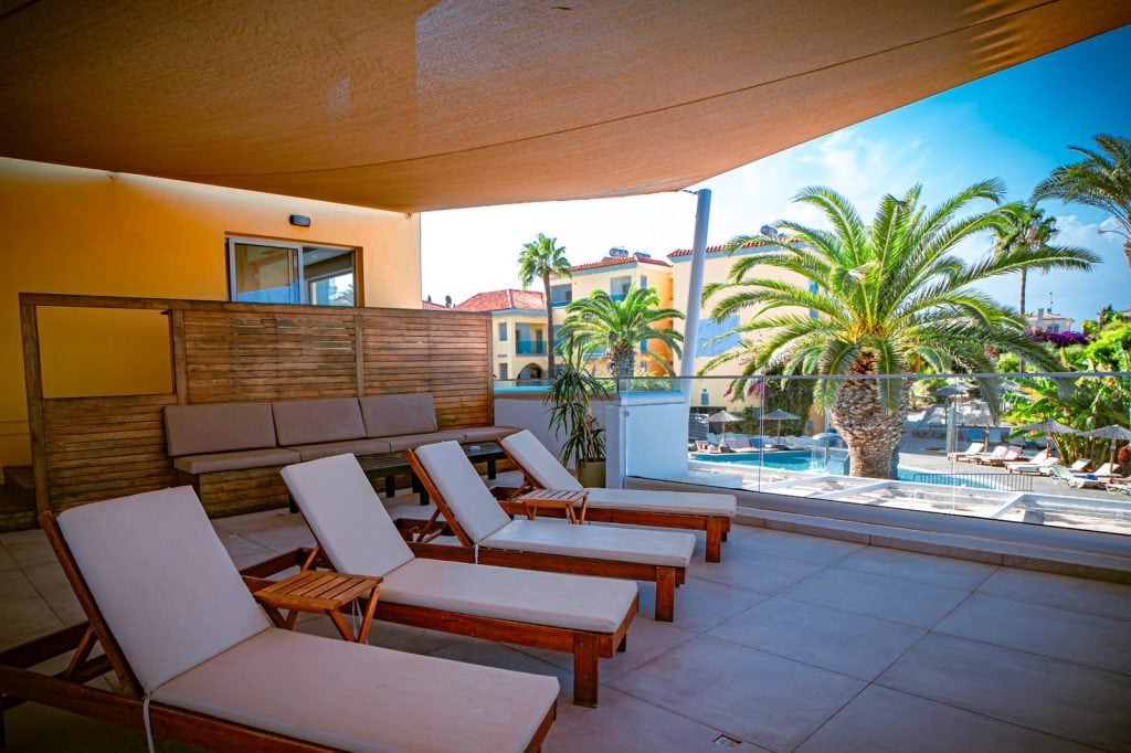 Deluxe Suite terrace loungers with sea and pool view, Malama Beach Holiday Village