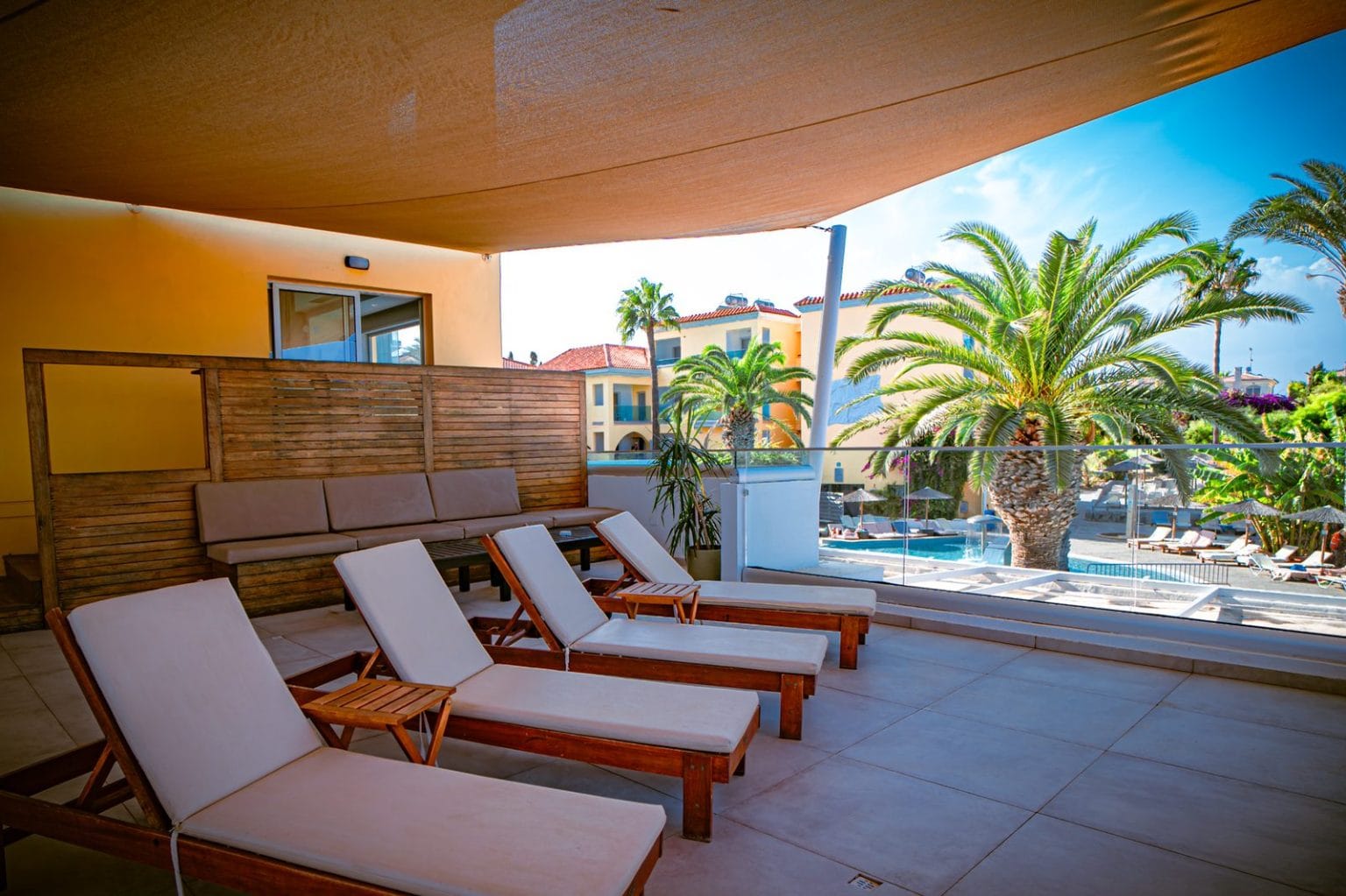 Deluxe Suite terrace loungers with sea and pool view, Malama Beach Holiday Village