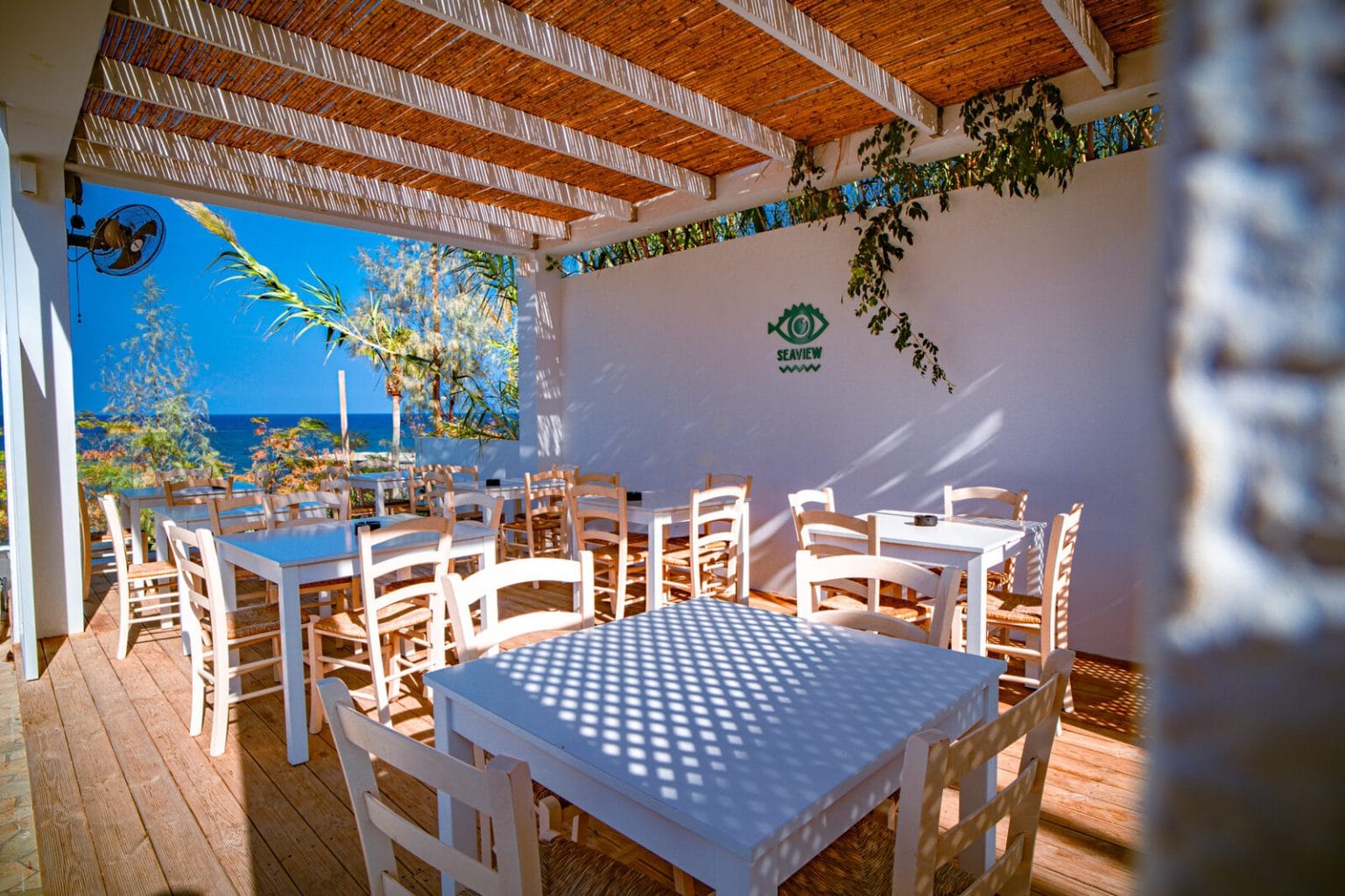 Tables under the Seaview Bar pergola at Malama Beach Holiday Village, Protaras