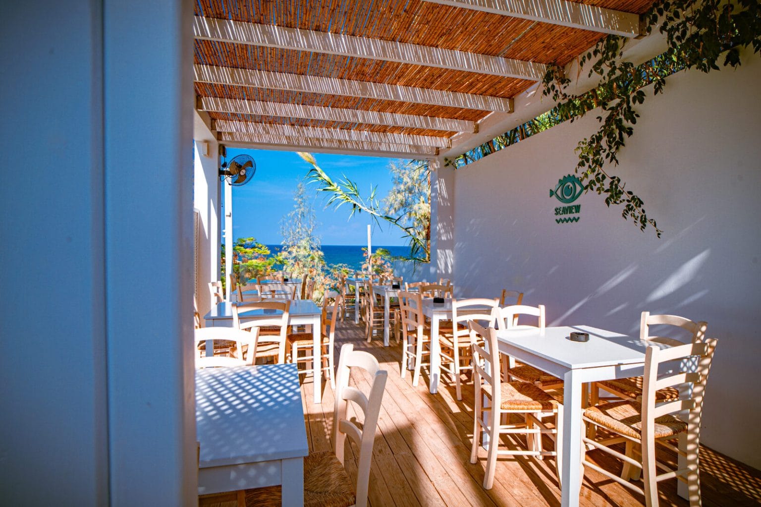 Shaded tables at the Seaview Bar, Malama Beach Holiday Village, Protaras