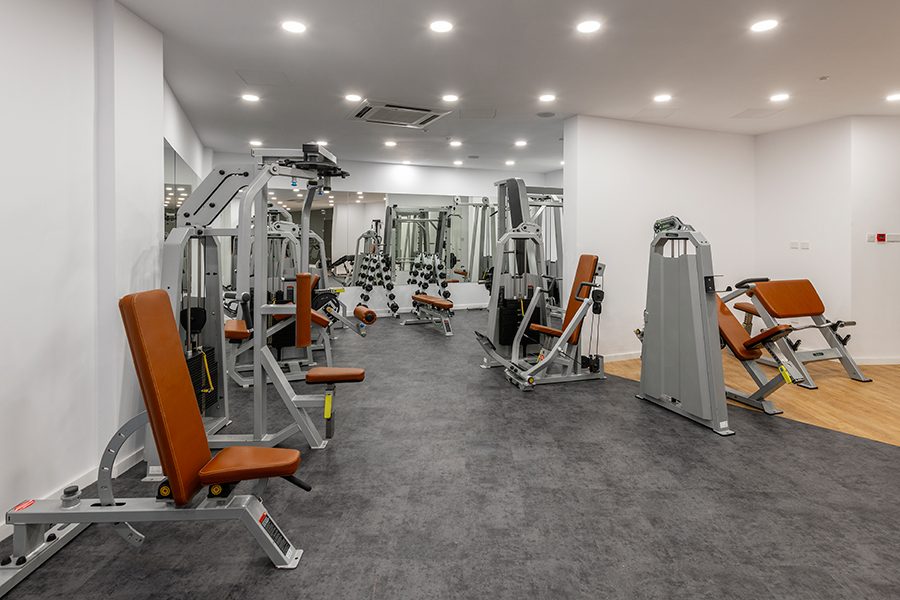Weights machines and benches in the air-conditioned gym at Malama Beach Holiday Village, Protaras